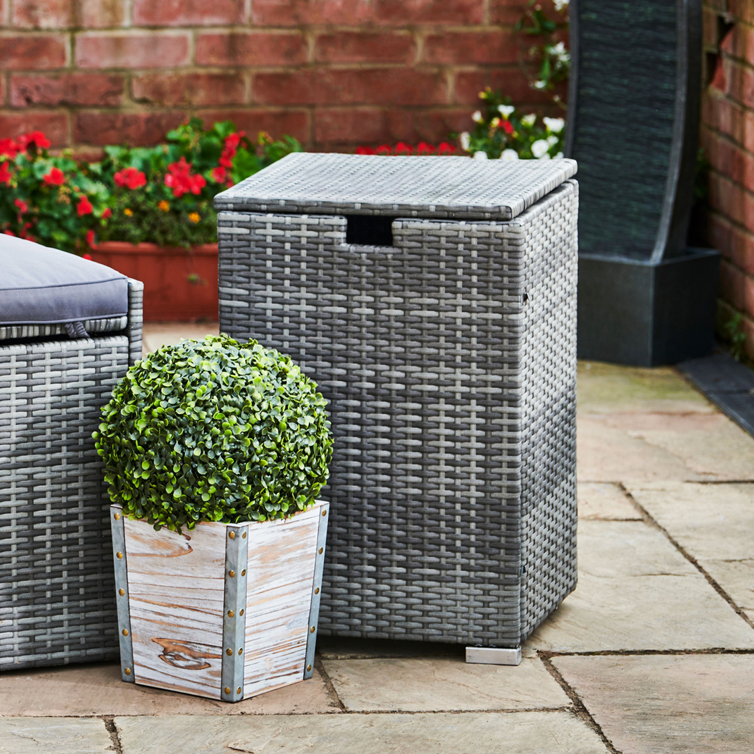 A gray PE wicker side table conceals a propane tank