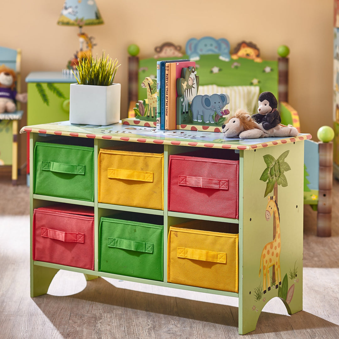 A sunny safari colorful kids storage cubbies sits in the middle of the similarly themed room.