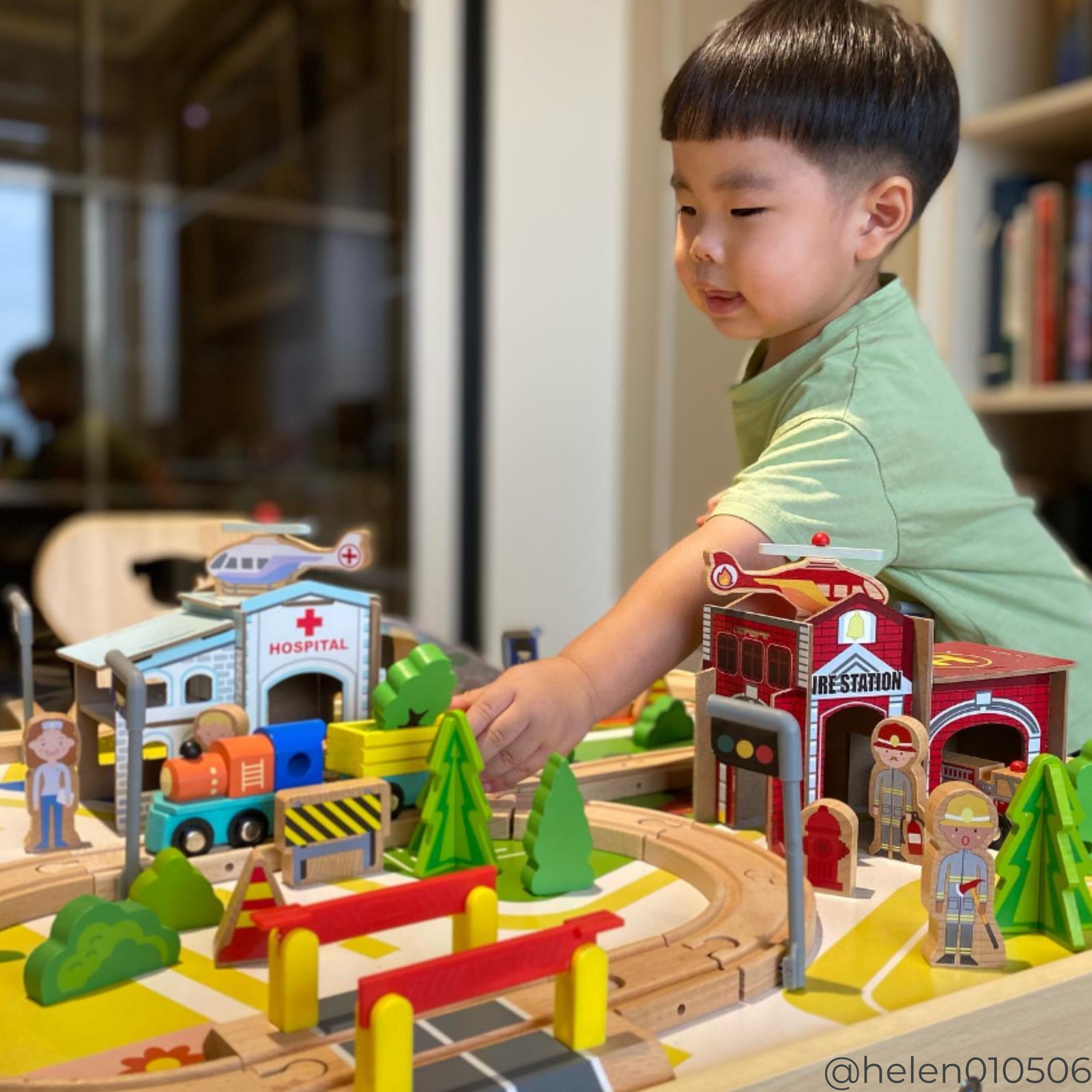 A boy playing with Teamson Kids - Preschool train table set