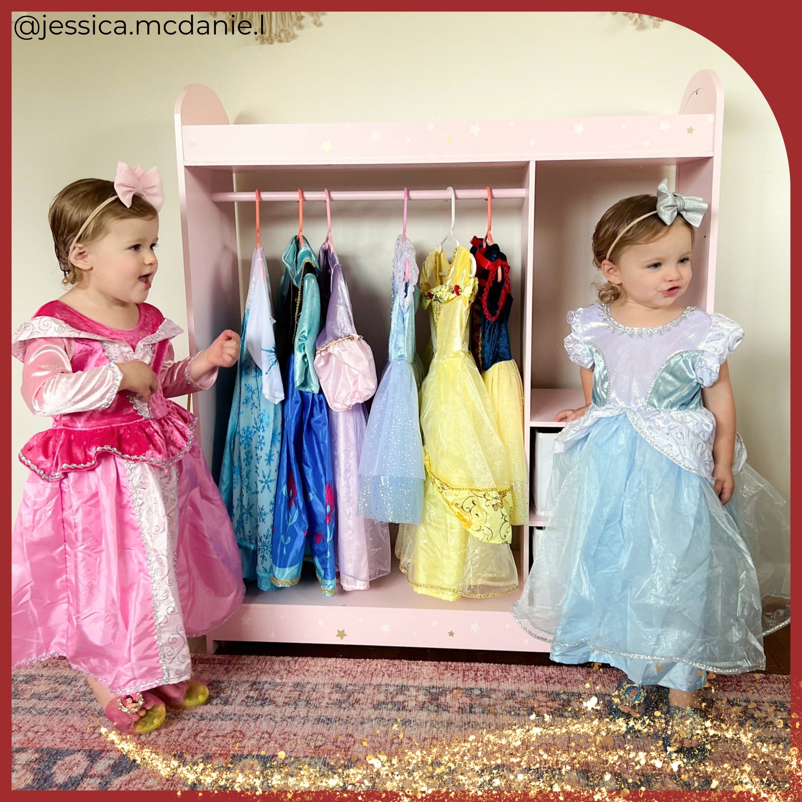 2 little girls stand in their costumes in front of a rack of other princess dress options