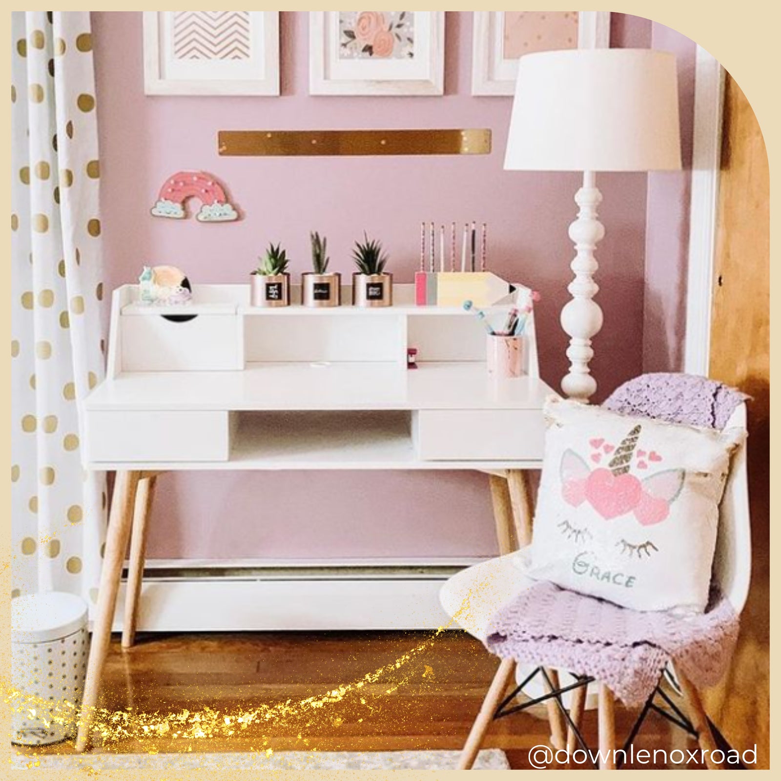 a white writing desk sits in a classy pink and gold room creating a space for creativity