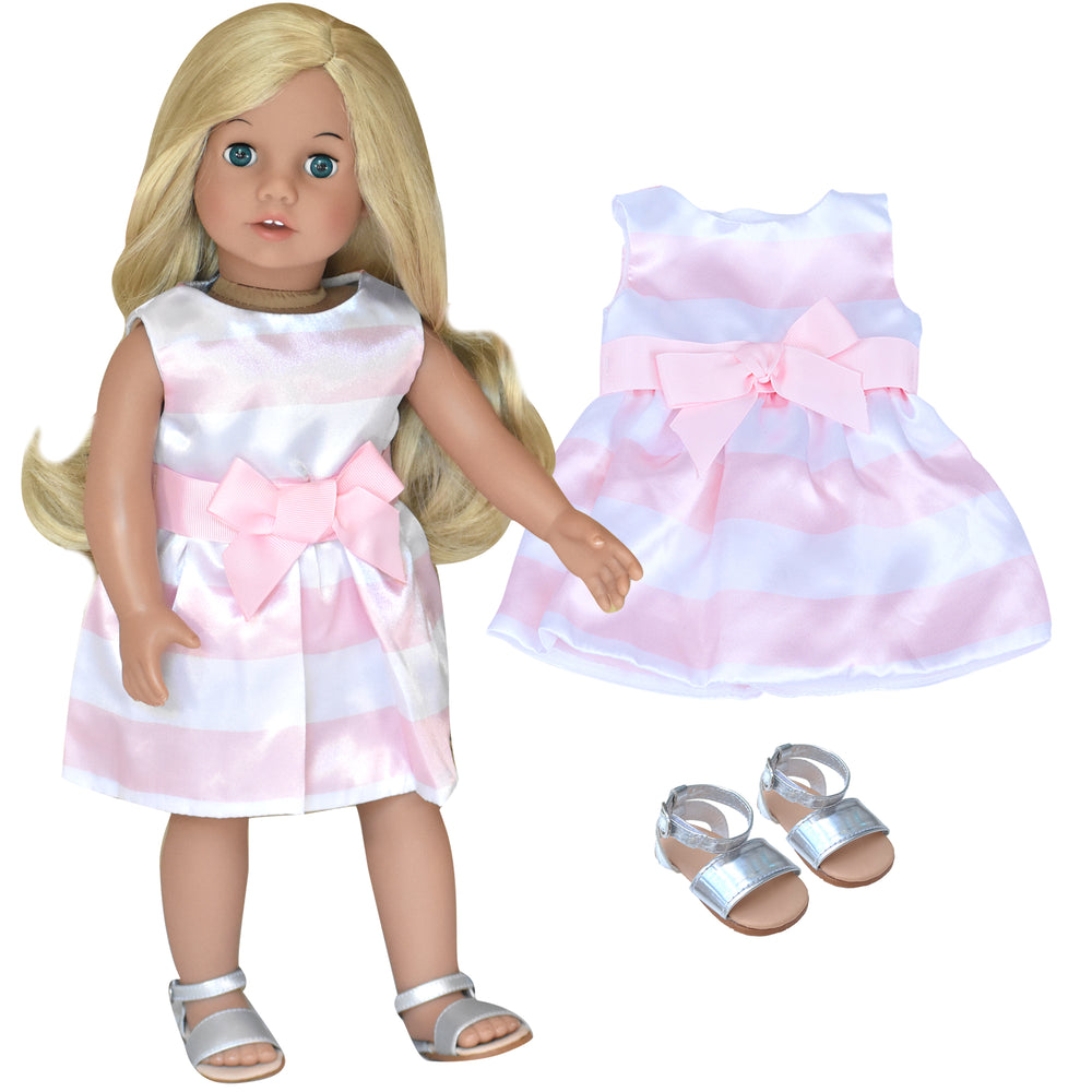A Sophia's Doll wear silver sandals and a pink striped party dress which is also shown flat next to her.