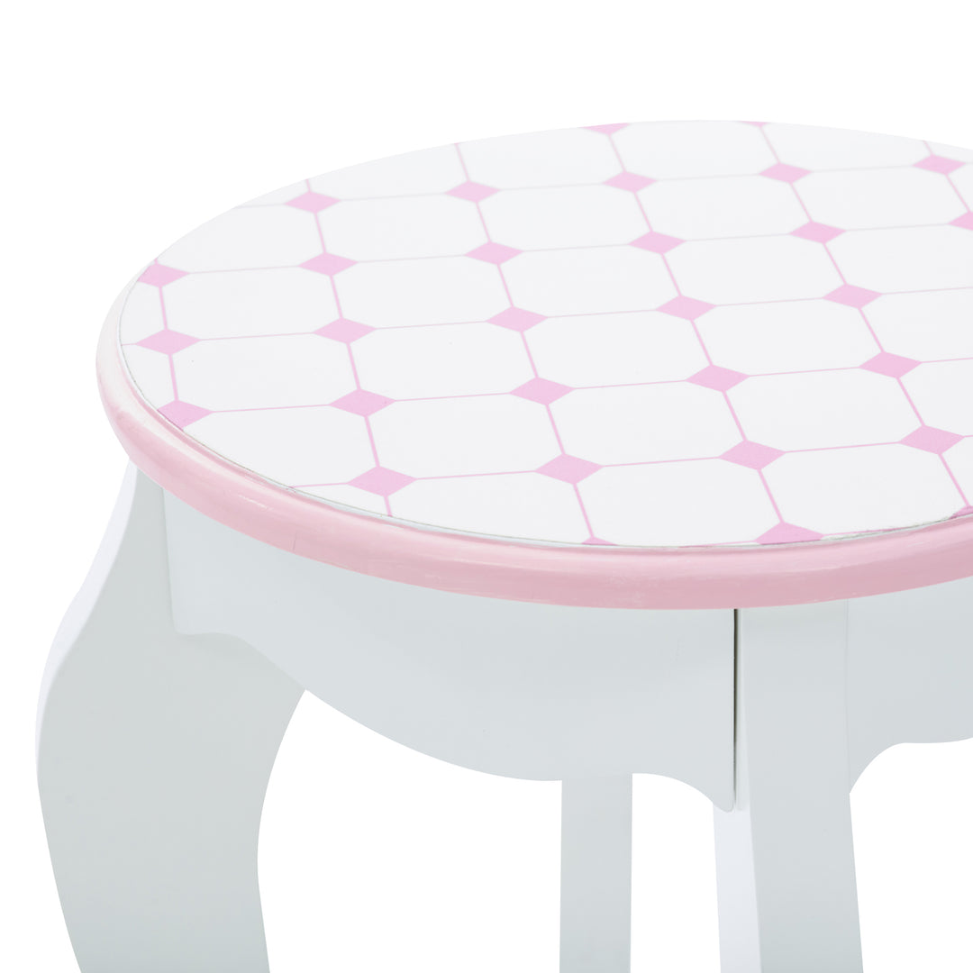 A white and pink stool with a Fantasy Fields Kids Dreamland Castle Vanity Set with Chair and Accessories, White/Pink pattern.