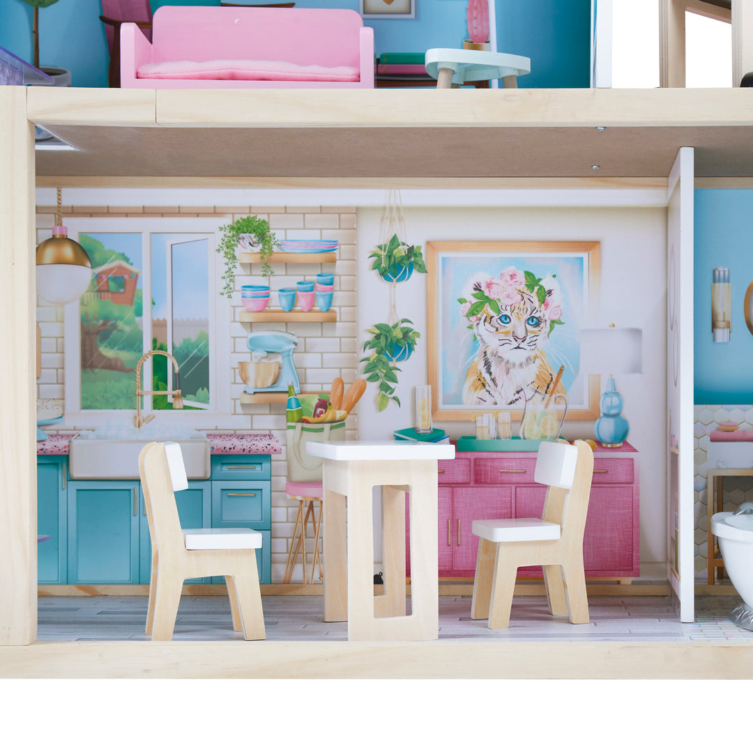 A close-up of the kitchen with the wood and white table and chairs.