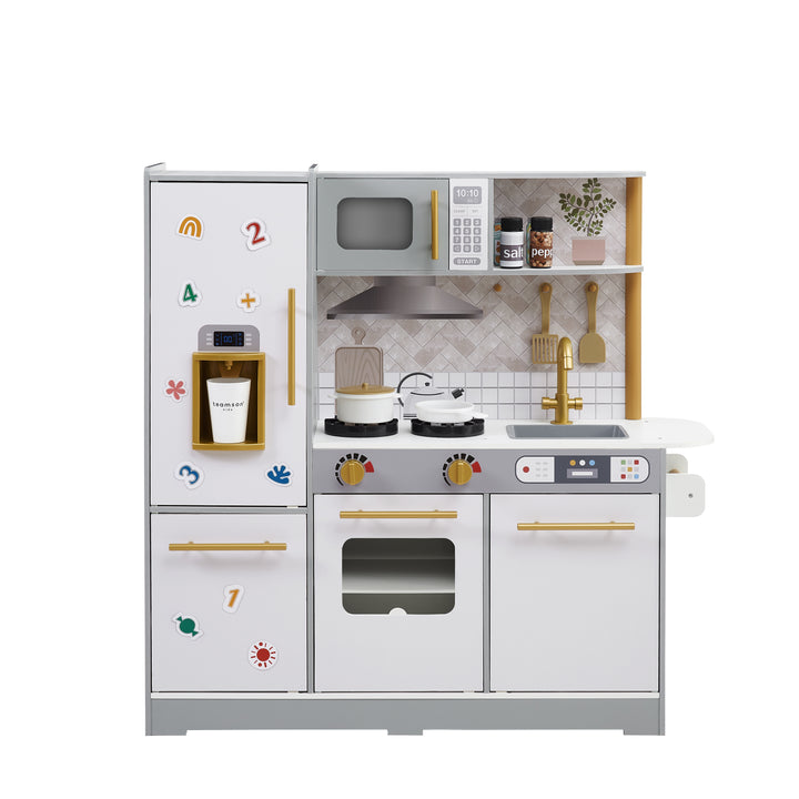 a gray kitchen with white facing cabinets features kitchen accessories and refigerator magnets