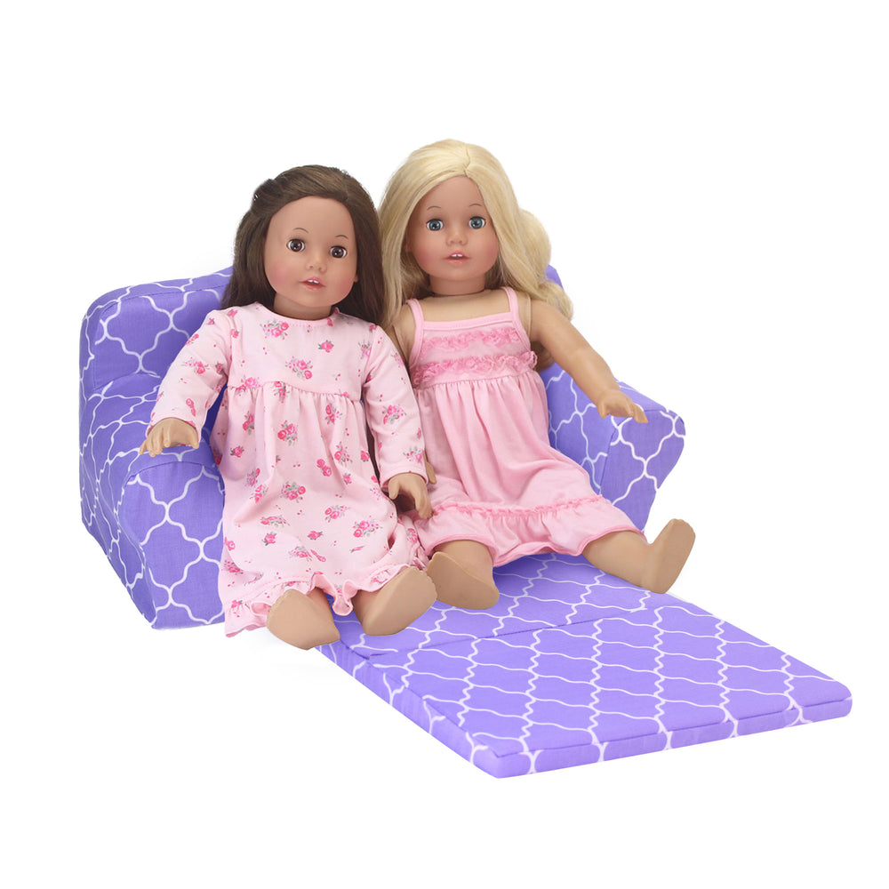 A brunette and a blonde 18" dolls sitting on a purple couch