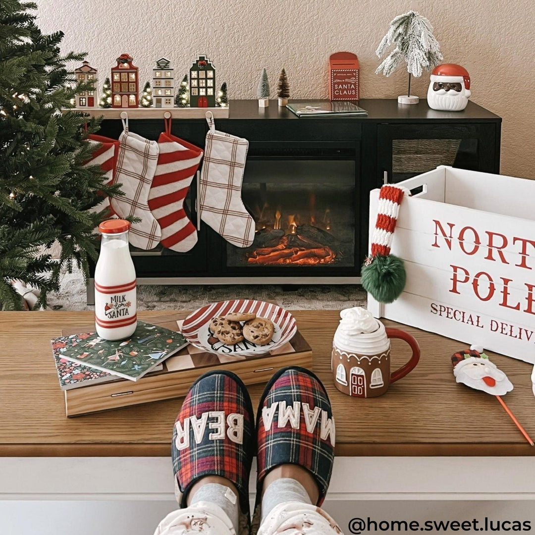 Black electric fireplace in a homey christmas setting