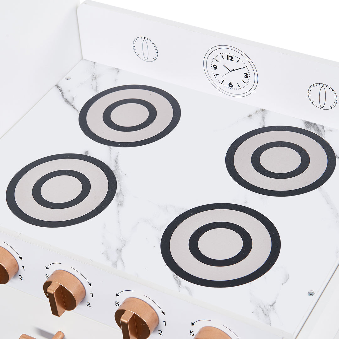 Close up of the play oven surface with the burners and faux white marble