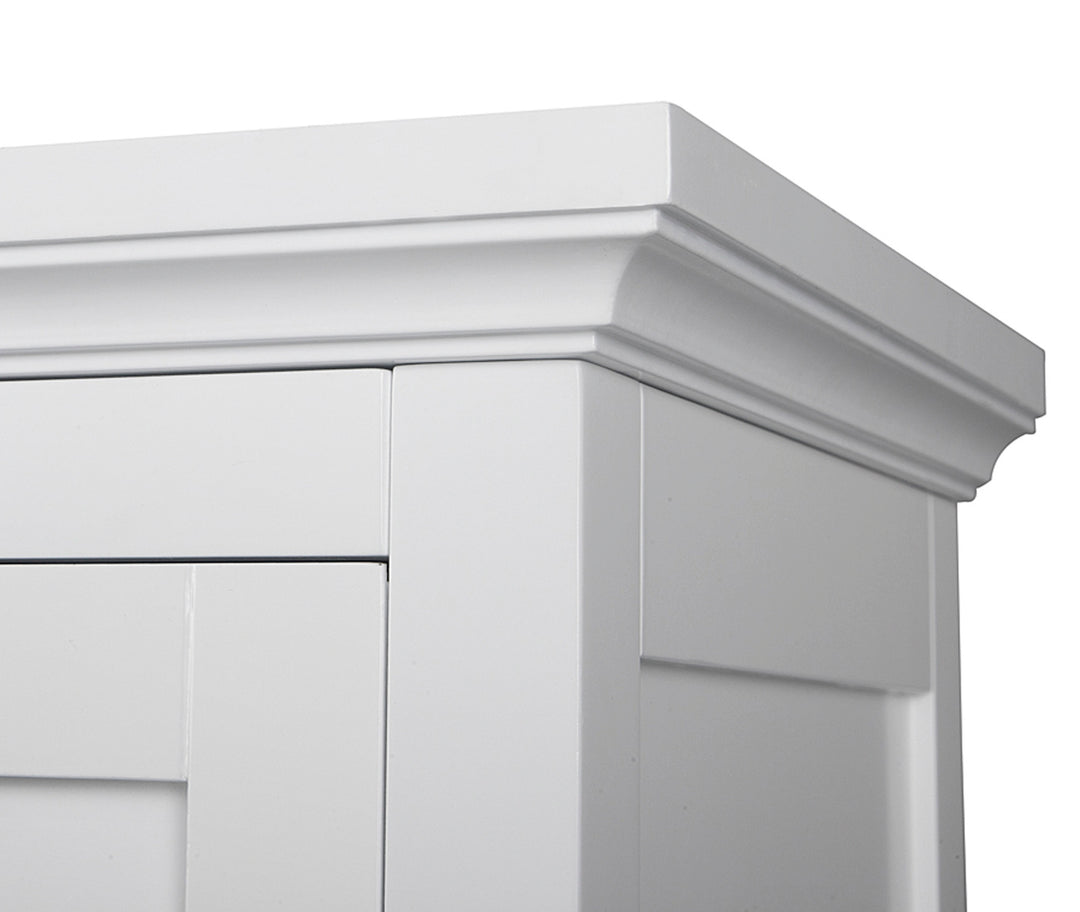 Close-up of the crown molding of a white floor cabinet