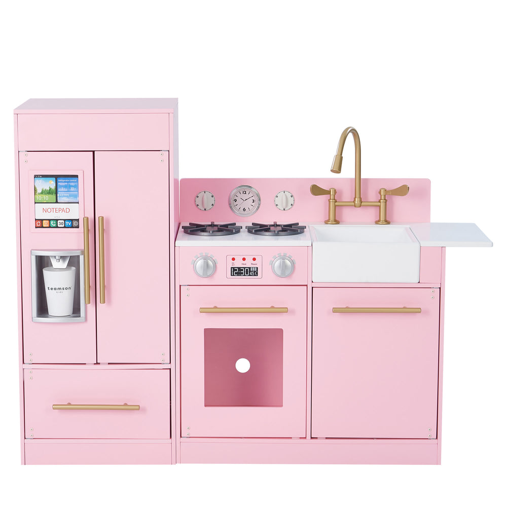 A modern pink play kitchen with gold hardware