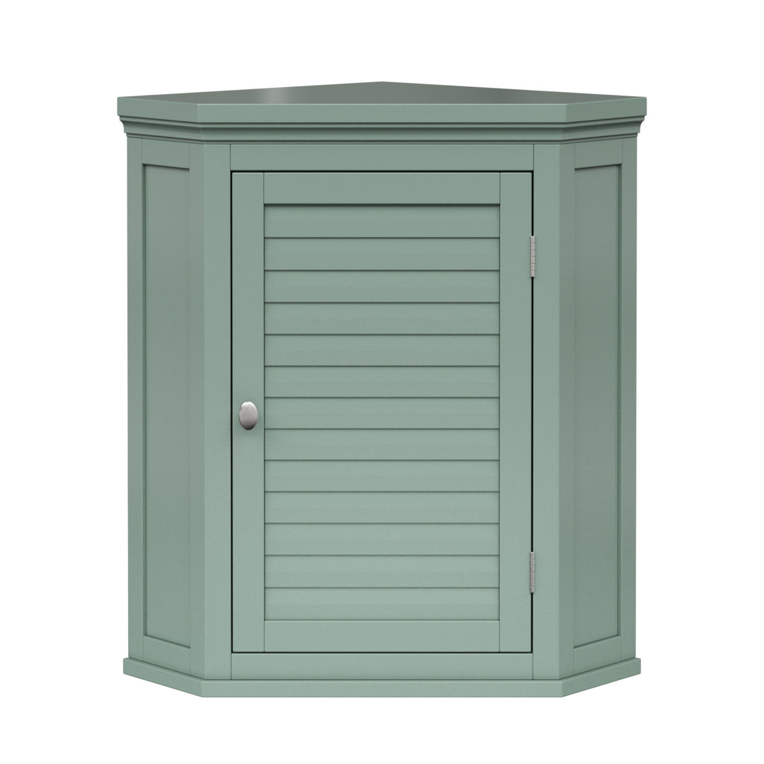 Sage green corner wall cabinet with silver hardware and faux louvered door.