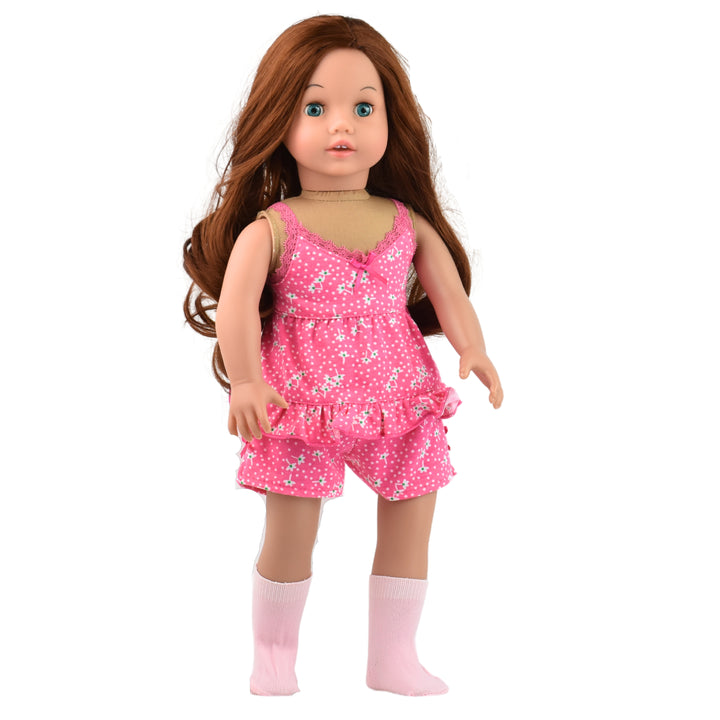 An auburn haired doll in pink print pajamas with pink socks