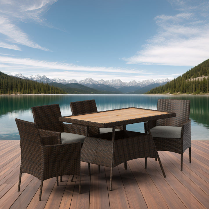 A 5-piece PE rattan dining set on a wooden deck in an outdoor setting