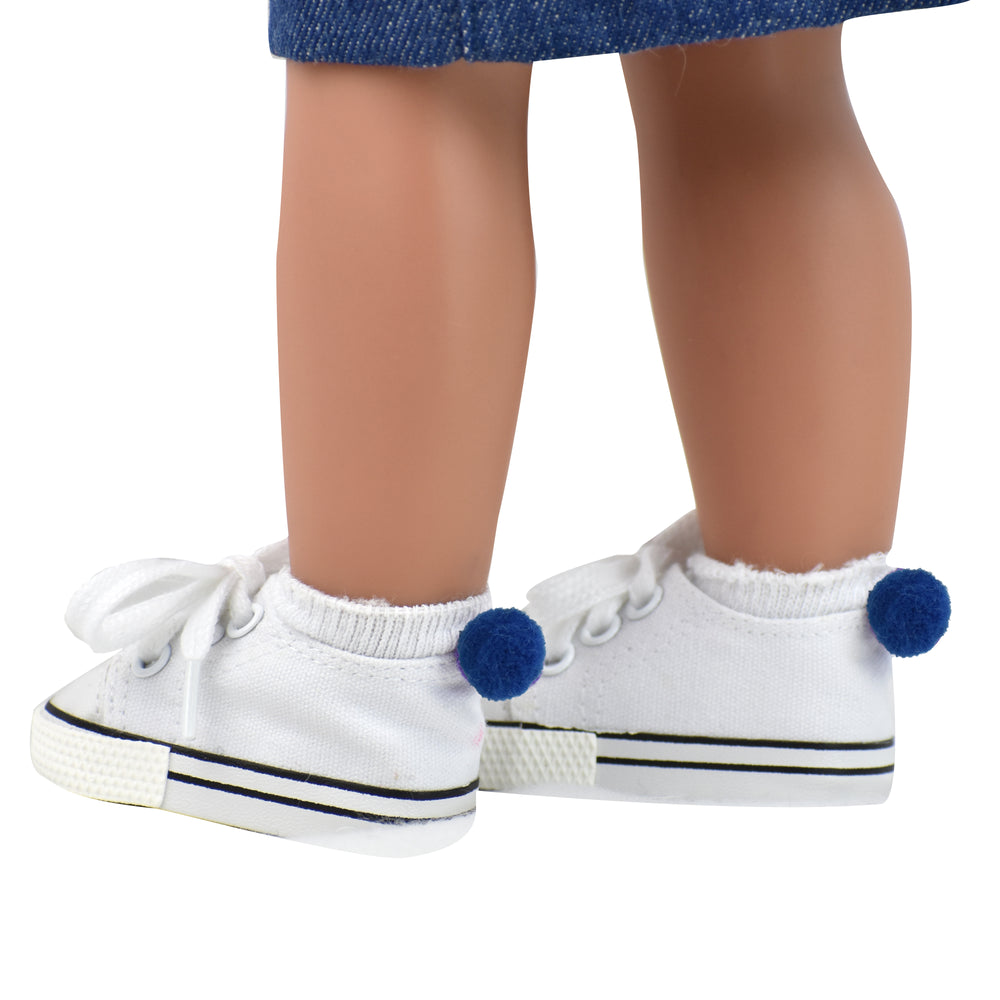 A pair of white footie socks with a navy pom pom on the back