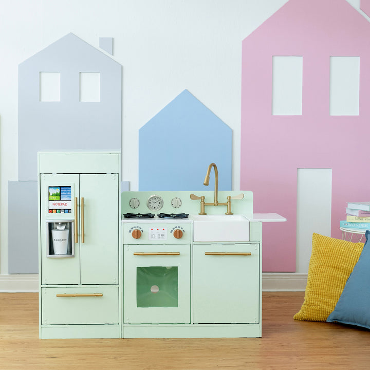 A modern-style mint play kitchen with gold hardware in a playroom