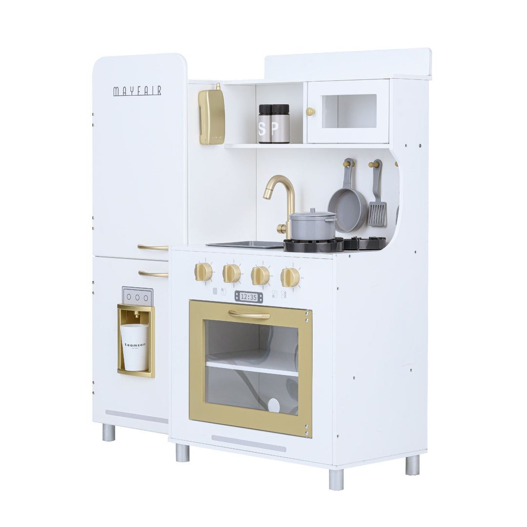 The sideview of a white and gold retro-styled play kitchen for kids