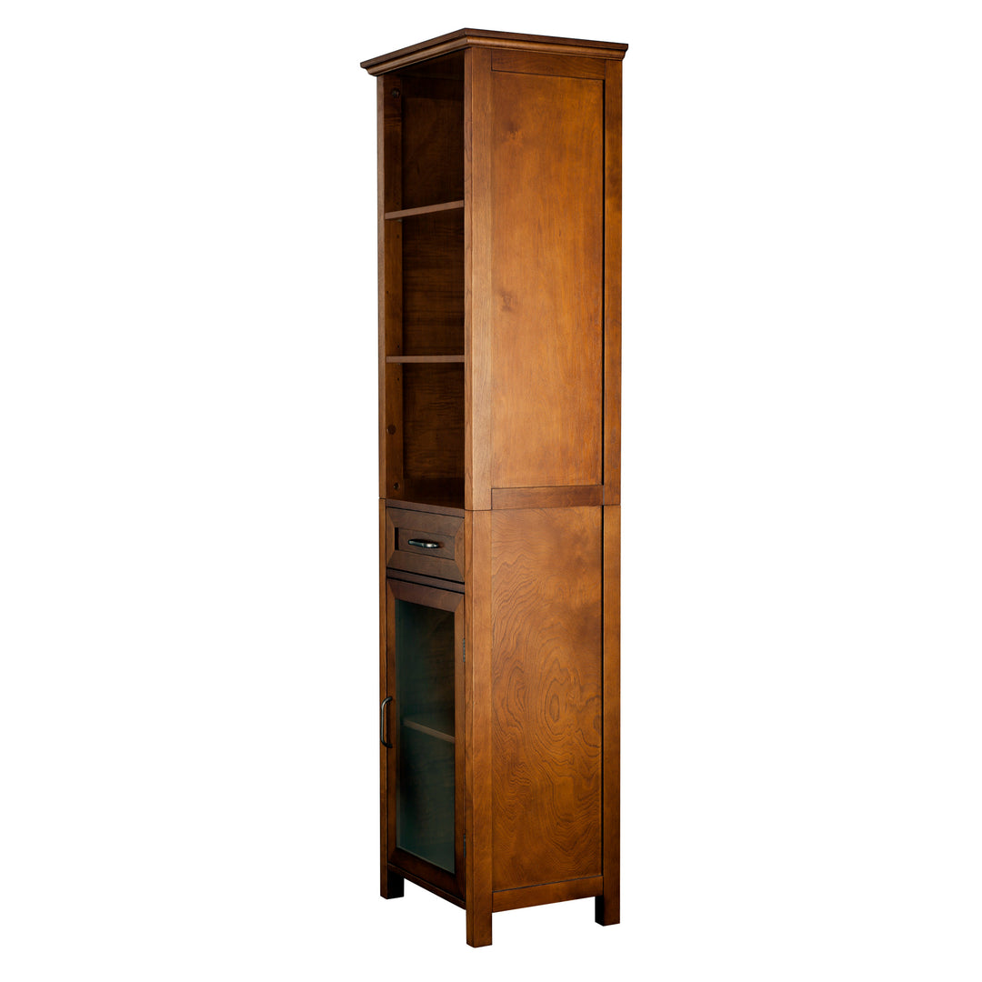 Side view of a tall brown linen cabinet with three shelves, a drawer and a cabinet with glass door