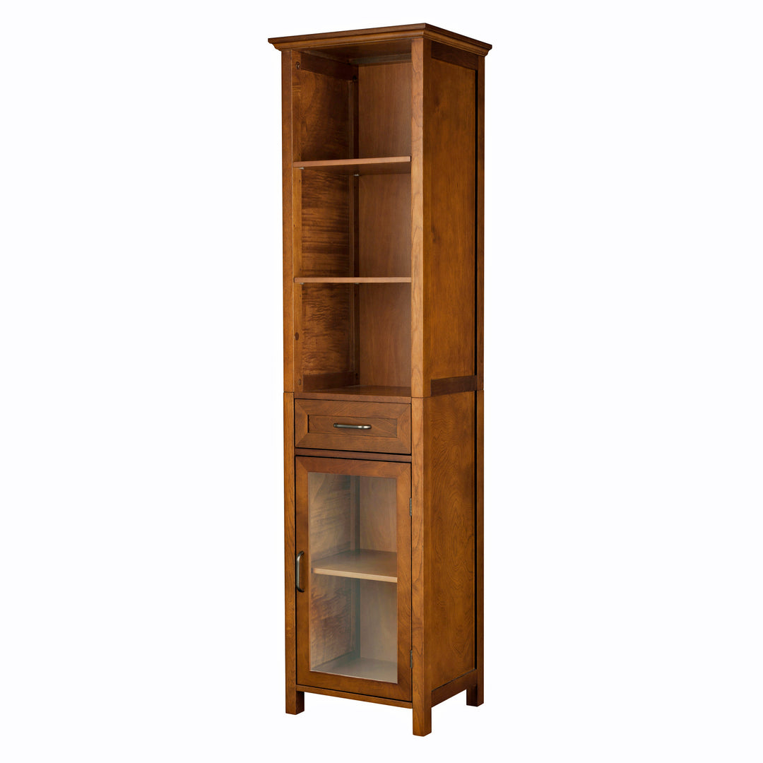 A tall brown linen cabinet with three shelves, a drawer and a cabinet with glass door