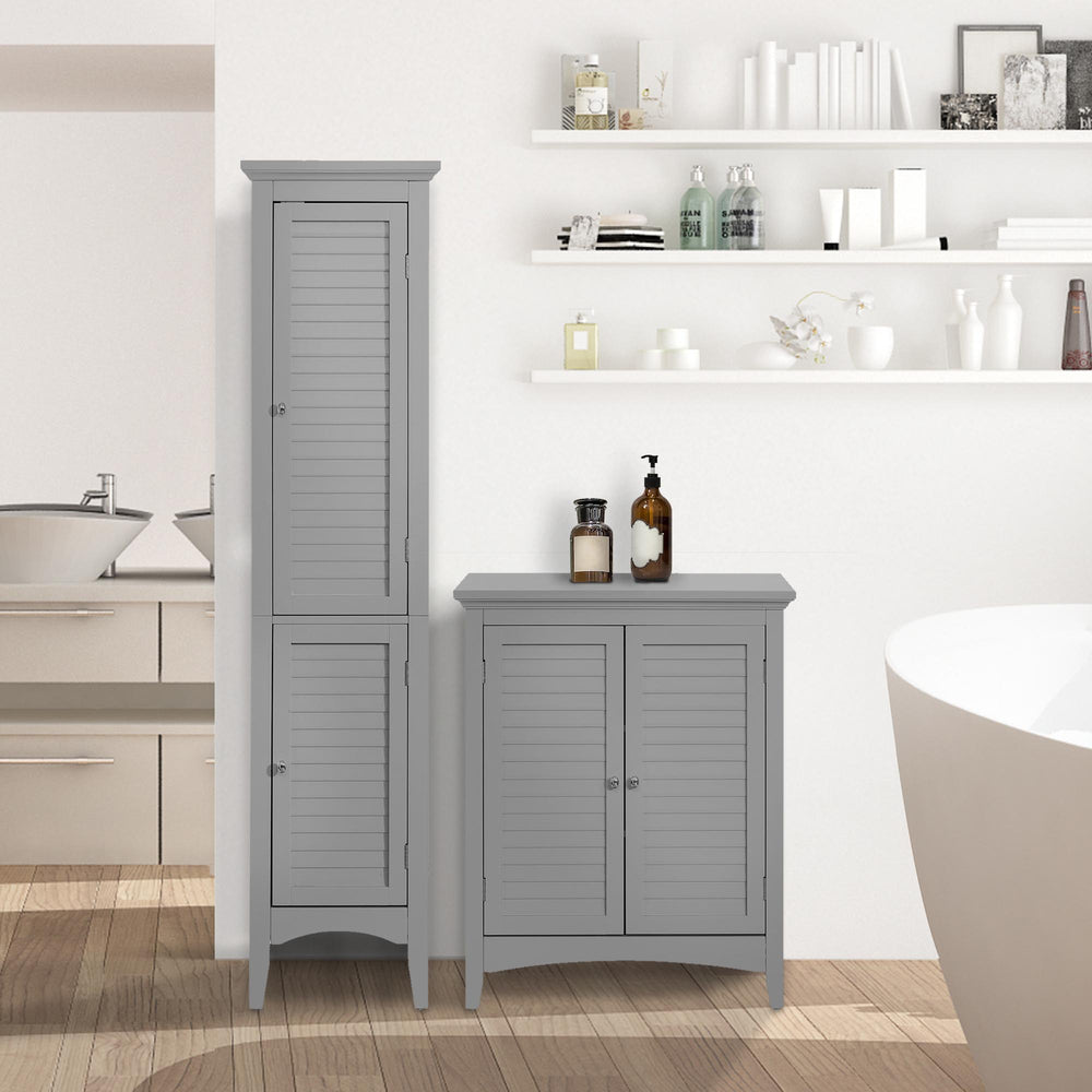 A gray tall linen cabinet and matching two-door floor cabinet in a bathroom