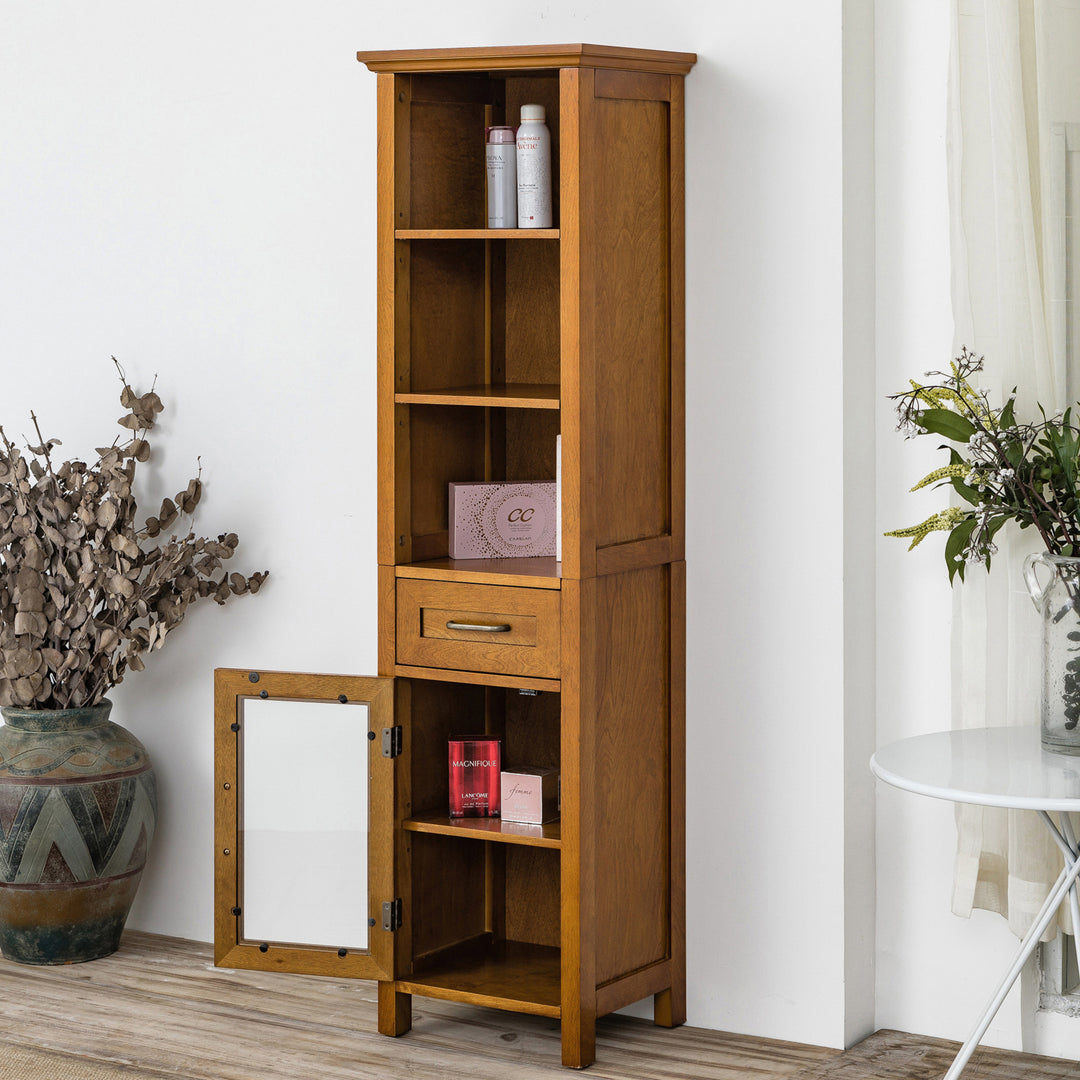 A tall brown linen cabinet with mixed storage and a drawer with items on the shelves