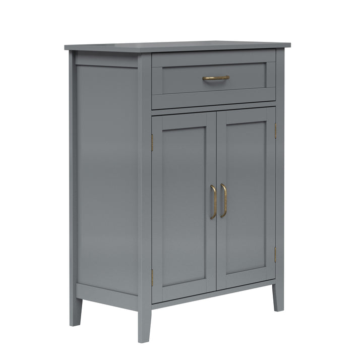 Angled view of the gray cabinet with antique hardware.