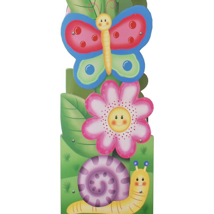 Close-up of illustrated butterfly, flower and snail on the side of a bookshelf