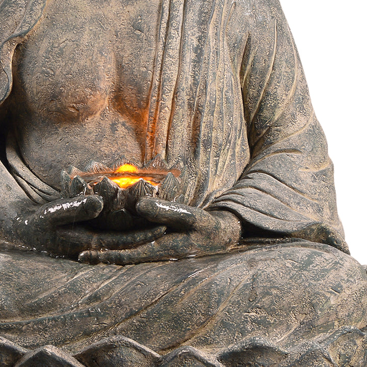 close up image of the glowing flower in Buddha's hand