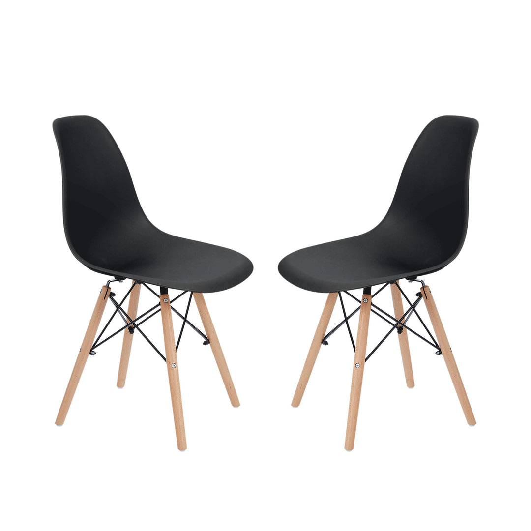 A pair of black dining chairs facing each other