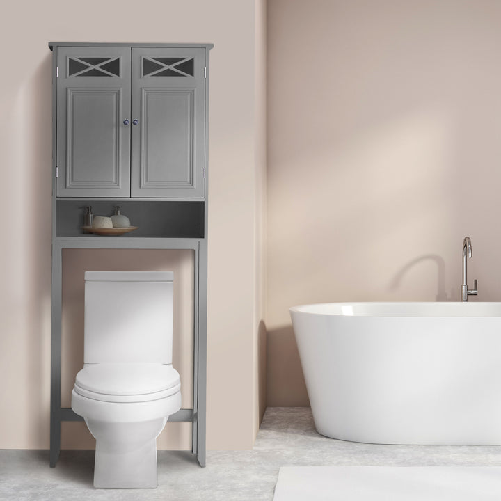 Gray over-the-toilet cabinet over a white toilet next to a white bathtub