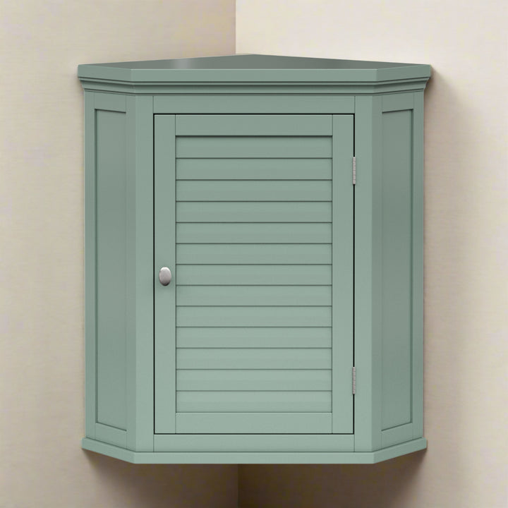 Sage green corner wall cabinet in a beige room.