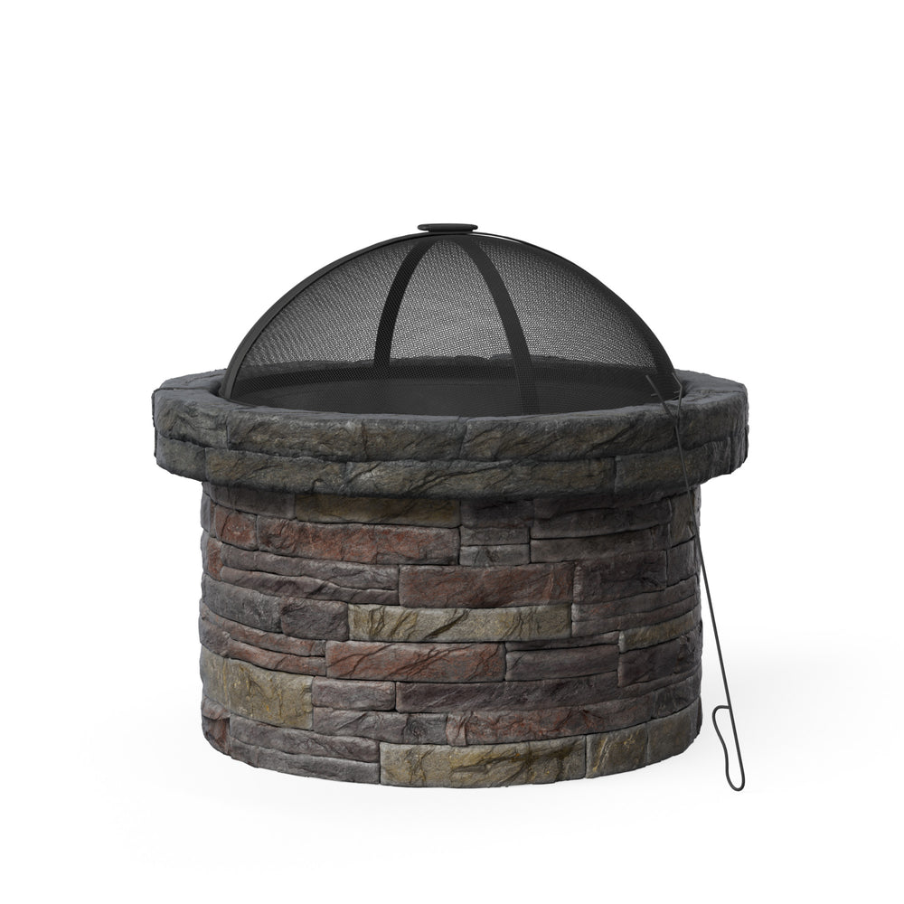 A round faux brick wood burning fire pit with a spark screen and poker