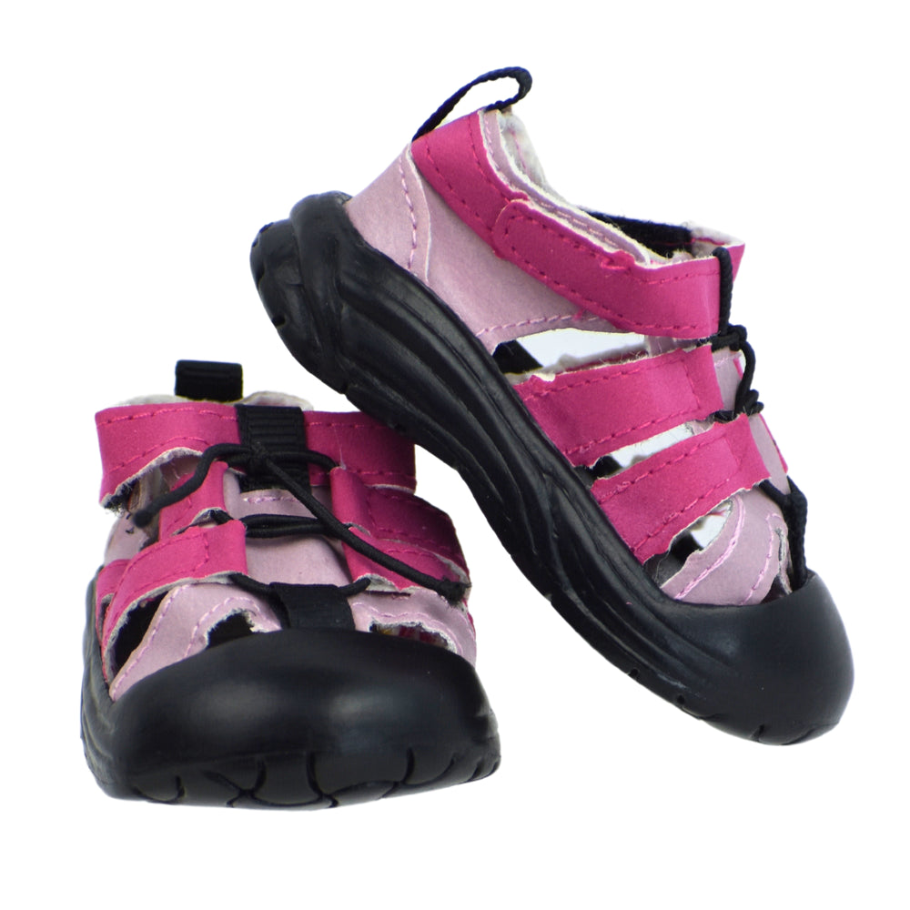 The pink Sophia's water hiking shoes with one shoe propped up on the other.