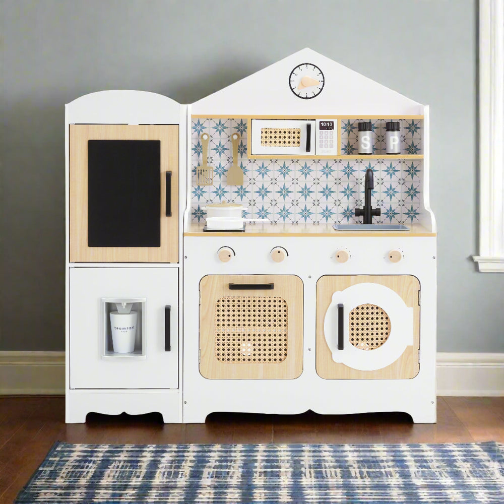 a bohemian style kids play kitchen is shown in a living room