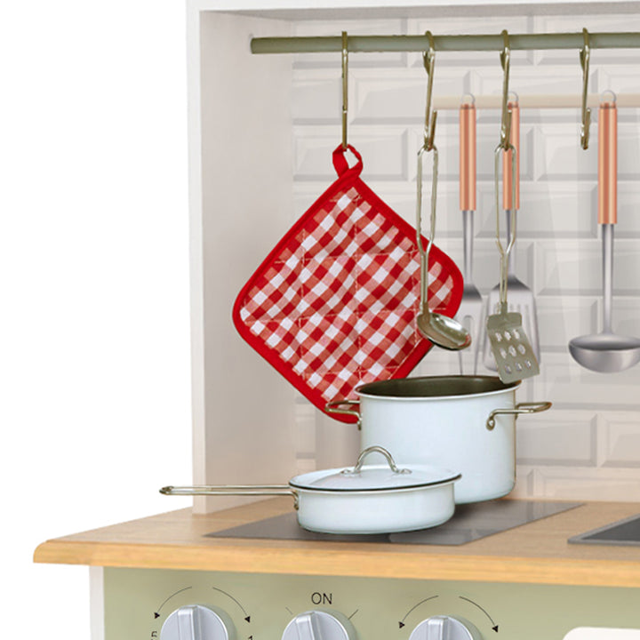 A closeup of a red and white gingham pot holder, ladle and spatula that are included