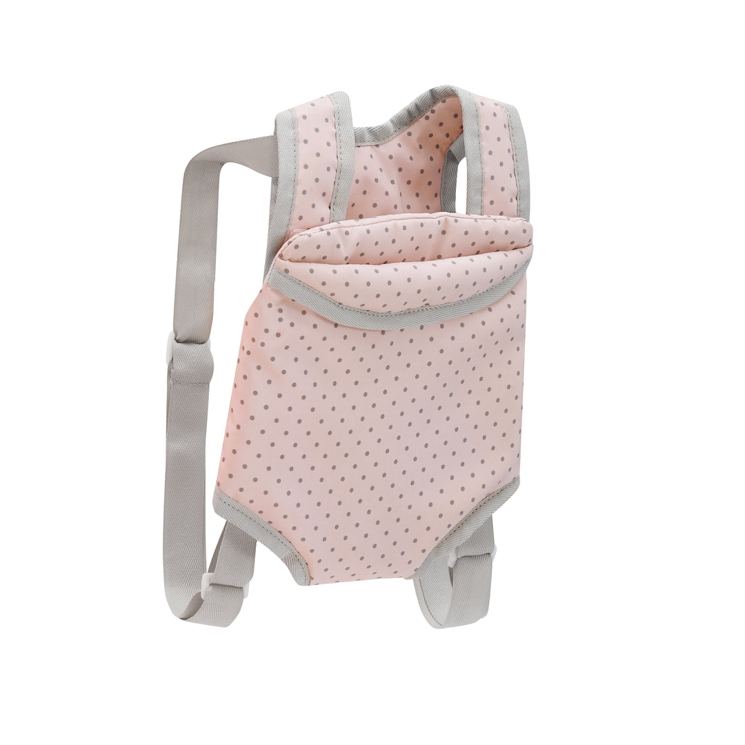 A child's baby harness in pink with gray  polka dots