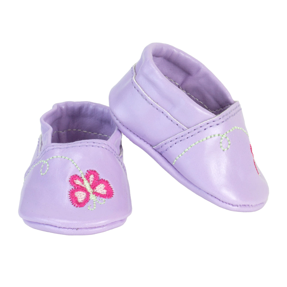 A pair of purple slide on shoes for an 18" doll