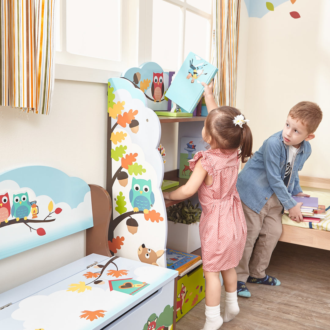 A little girl reaches up to put a book on the top shelf of a child's bookshelf, illustrated with woodland animals.