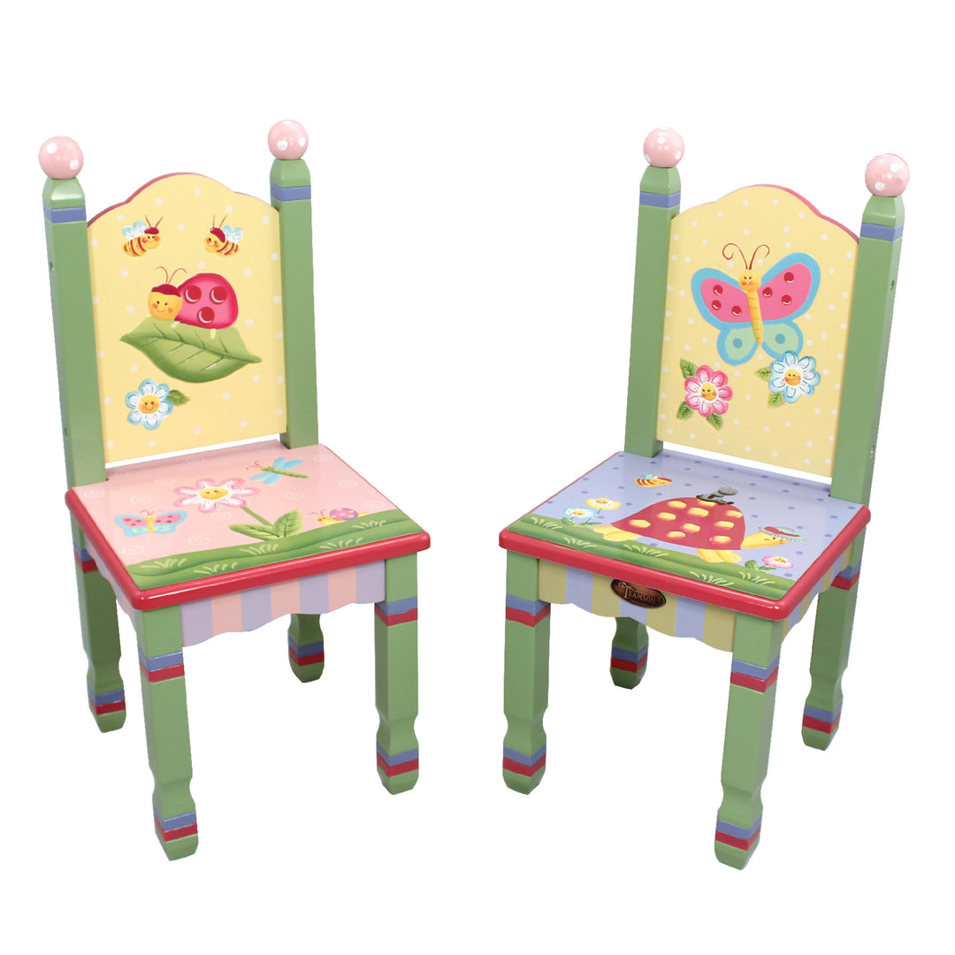 A pair of brightly colored child-sized chairs with high backs